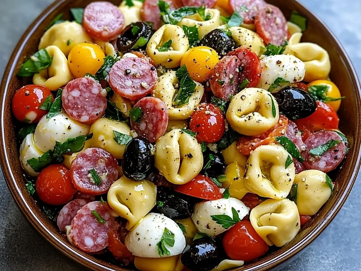Close-up of tortellini pasta salad ingredients before mixing