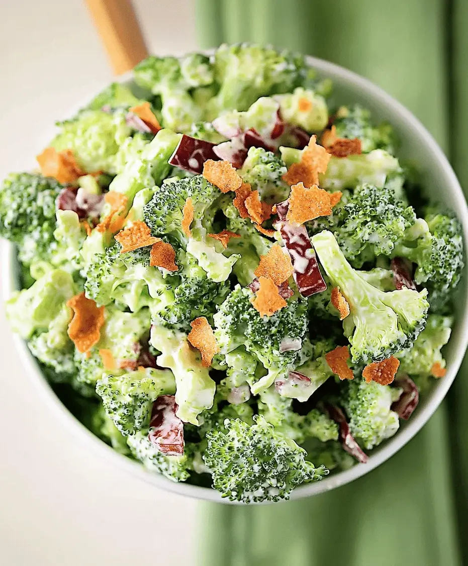 Close-up of broccoli salad ingredients being mixed.