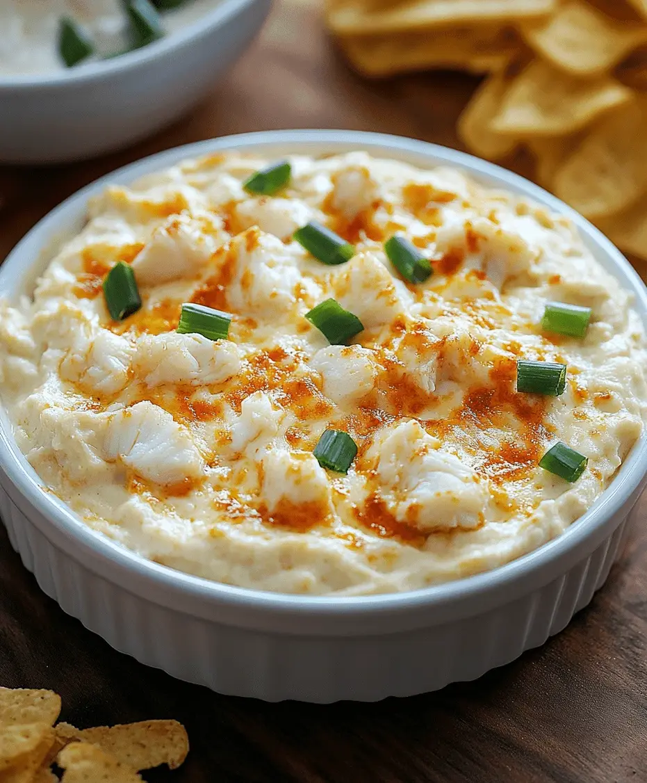 A serving of crab dip with crackers and a small spoon.