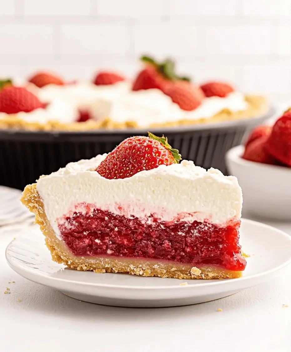 A close-up shot of a slice of strawberry icebox pie showing the creamy filling and graham cracker crust.