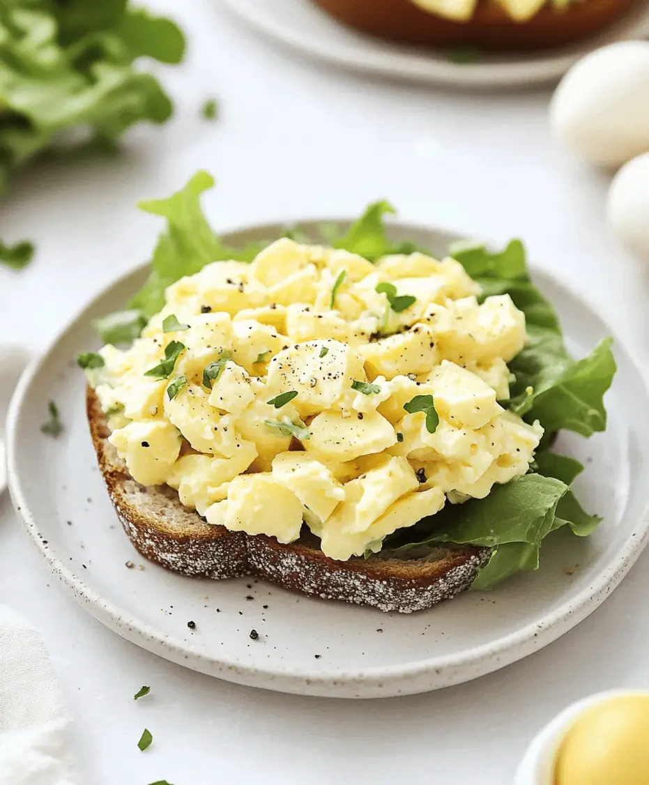 A close-up of old-fashioned egg salad in a sandwich with lettuce on toasted bread.