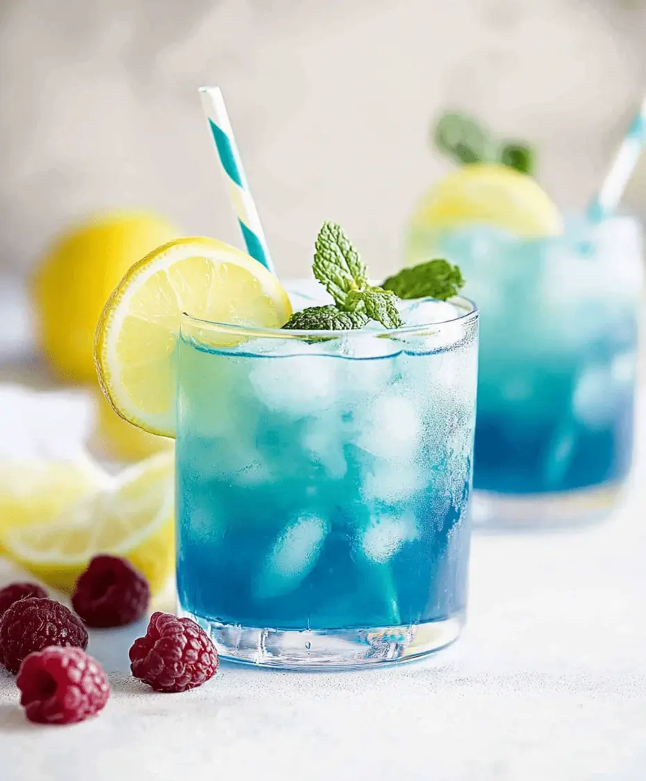 Close-up of a tall glass of vibrant blue raspberry lemonade with ice, a lemon slice, and condensation on the glass.