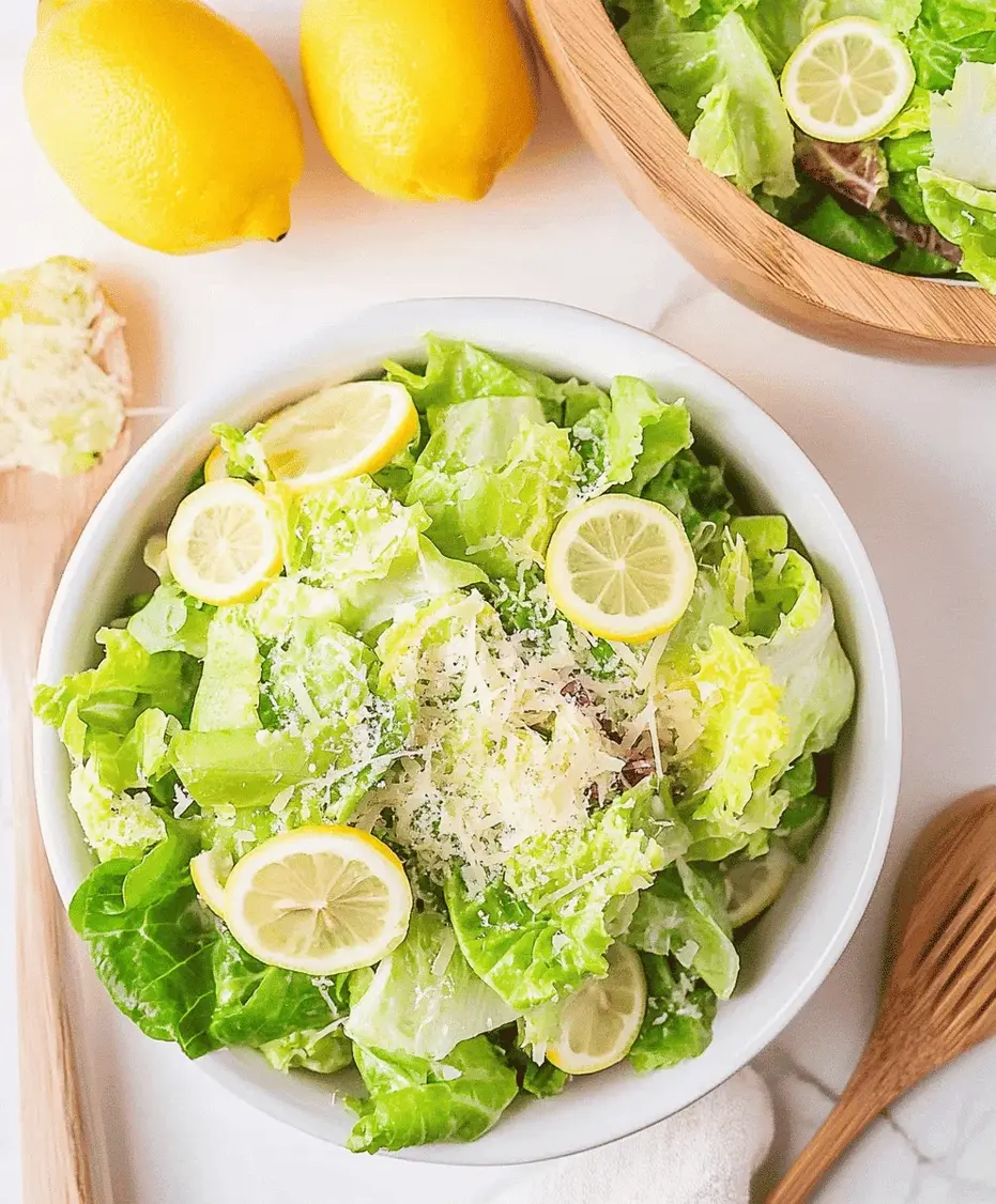 A bowl of fresh 5-minute Lemon Parmesan Lettuce Salad, ready to be served with a sprinkle of extra cheese.