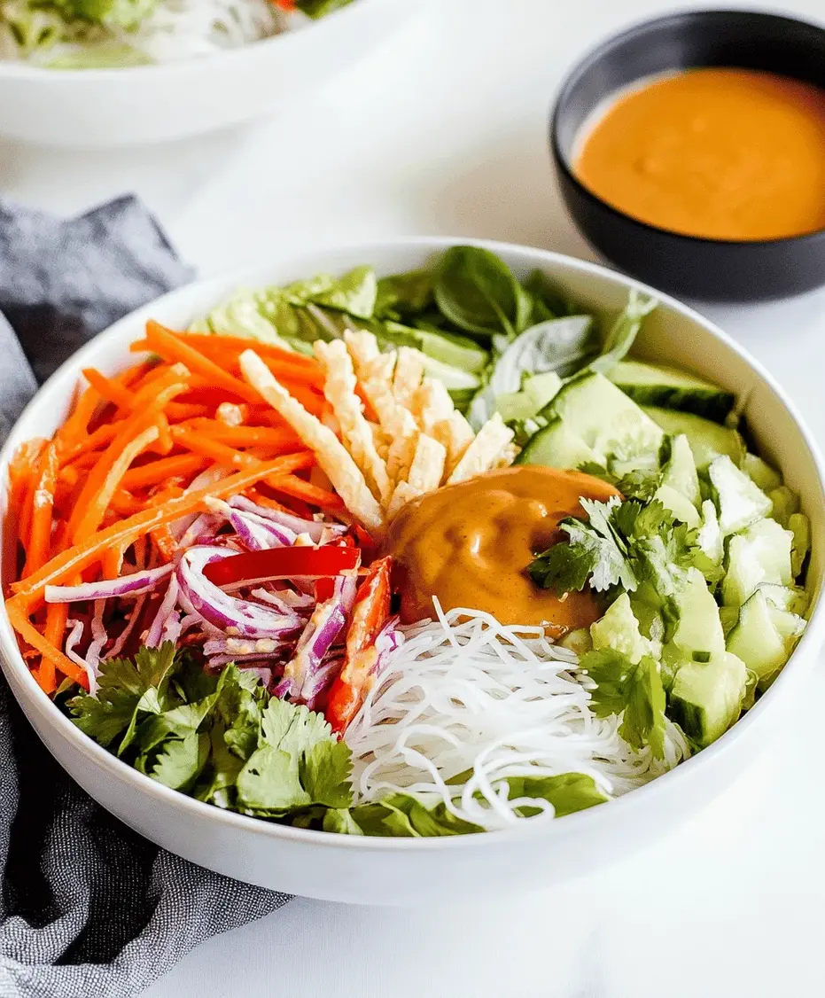Close-up of Spring Roll Salad with Peanut Sauce, highlighting the creamy sauce and fresh ingredients