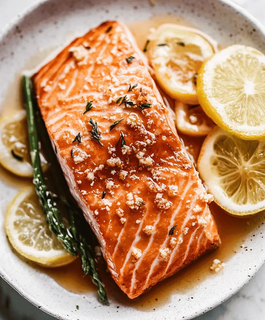 Honey baked salmon served on a plate with lemon wedges, roasted vegetables, and fresh herbs
