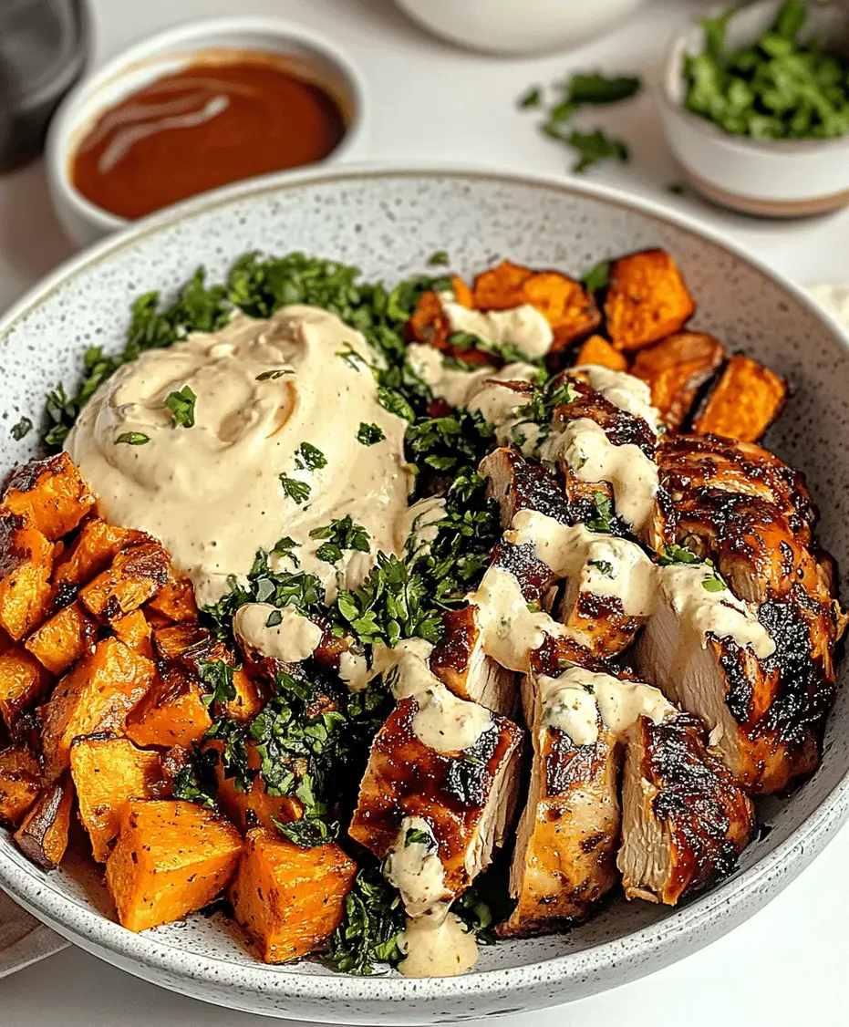 Beautifully assembled BBQ chicken and sweet potato bowl with avocado and cilantro